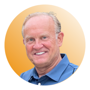Greg Schall, Executive Vice President and Head of Hospitality Growth Strategy at SOLID Surface Care, smiling in front of an orange background