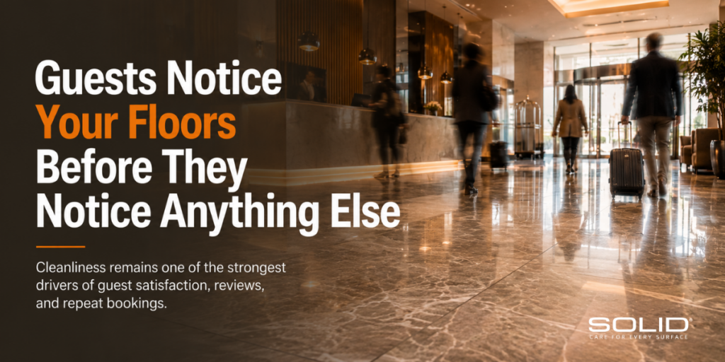 Luxury hotel lobby with polished stone flooring and guests moving through the space, highlighting the role of cleanliness and floor maintenance in creating positive first impressions and guest satisfaction.