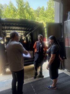 SOLID Surface Care Safety Manager Jim Crippen speaking with team members before an exterior maintenance project.